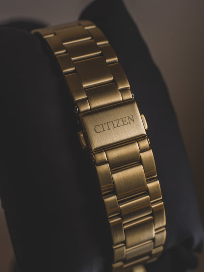 Reloj Citizen de cuarzo con esfera azul y tono dorado para hombre BI1032-58L